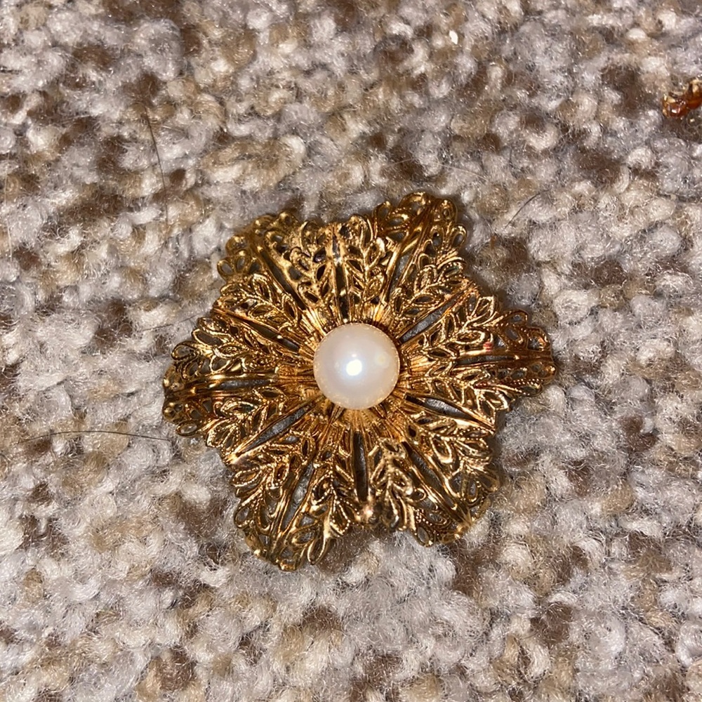 Gold intricate flower with pearl brooch